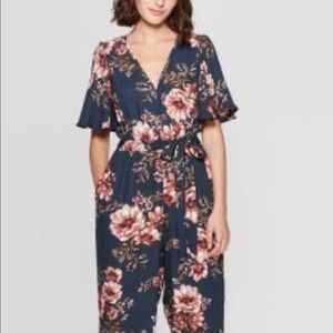 Floral navy jumpsuit, new with tags, size medium
